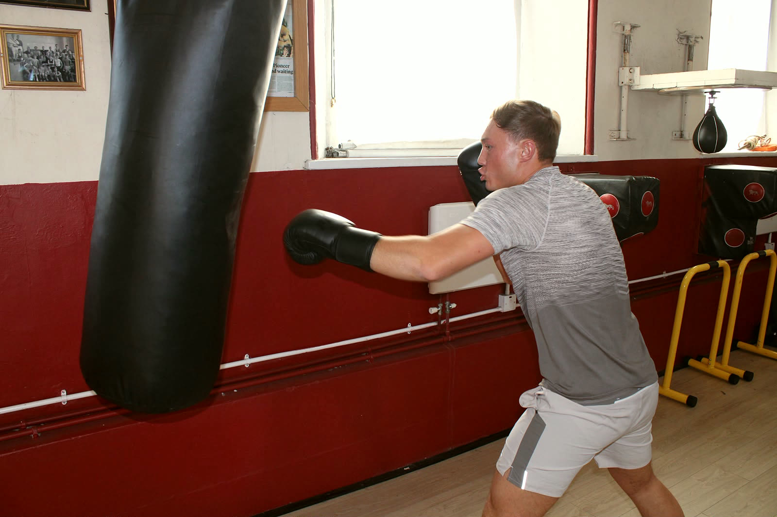 Bag work by the arched windows of the hall