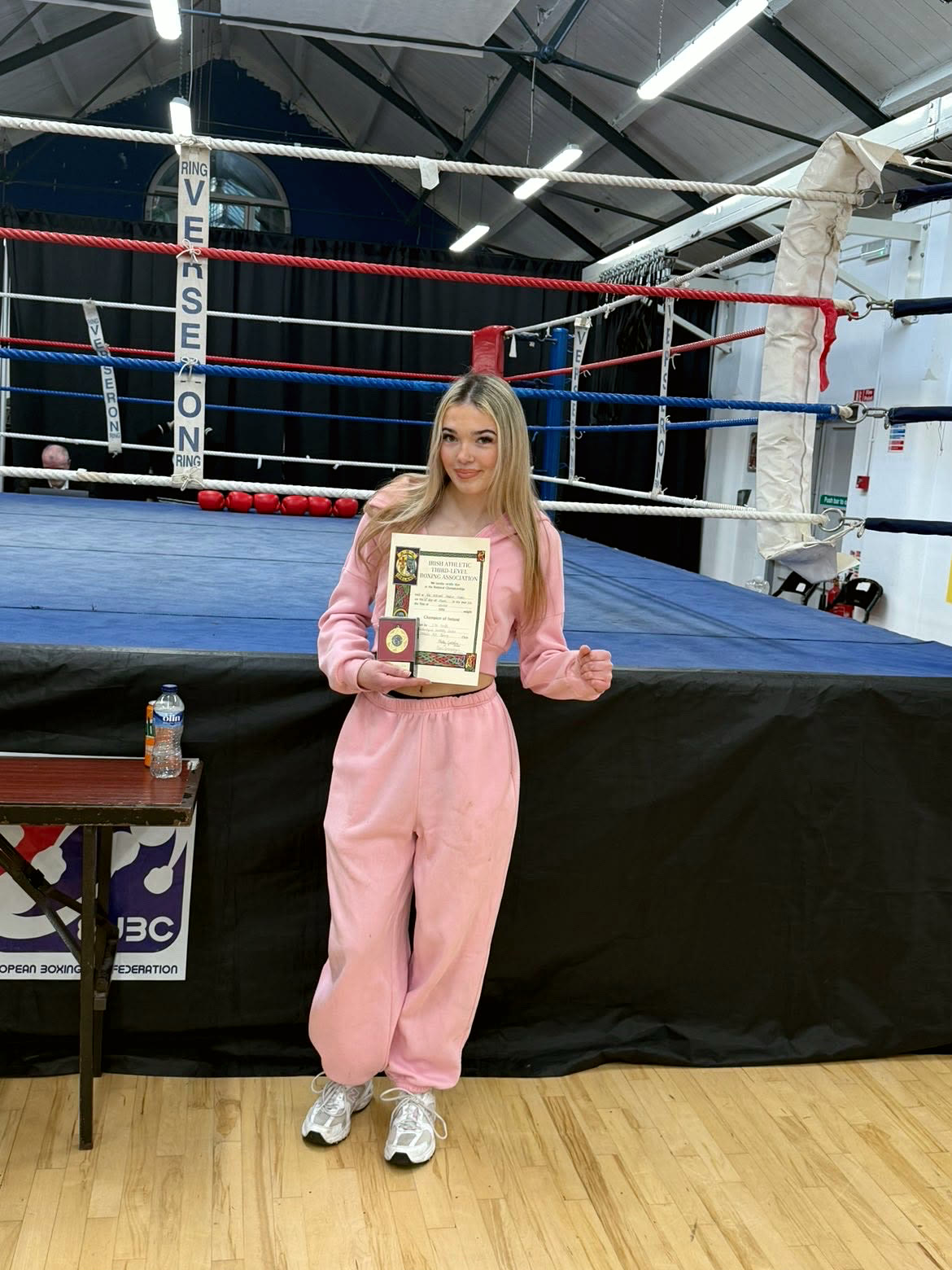 Ella holding her national title certificate in the club